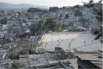  ?? JOHN MOORE/GETTY IMAGES FILES ?? Teams play soccer on a hillside in Guatemala City’s Zone 18, infamous for gang-related crime. It was scenes like this that Blue Jays pitcher Joe Biagini saw on his trip.