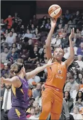  ?? Jessica Hill Associated Press ?? CONNECTICU­T’S Jonquel Jones, who scored 27 points, shoots over the Sparks’ Sydney Wiese.