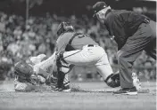  ?? NEVILLE E. GUARD USA TODAY NETWORK ?? Reds pinch-hitter Stuart Fairchild slides in safely against Giants catcher Jakson Reetz for an inside the park home run during the eighth inning Friday in San Francisco.