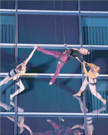  ?? Kevin Winter Getty Images ?? THE SINGER PINK performs an aerial rendition of “Beautiful Trauma” at the AMAs on Sunday.