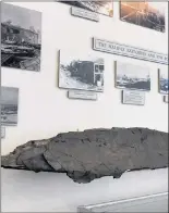  ??  ?? Destroyed roofing boards from the Halifax Explosion are seen at the Naval Museum of Halifax.