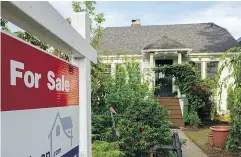  ?? GERRY KAHRMANN / POSTMEDIA NEWS FILES ?? Interest rate hikes could exacerbate a housing affordabil­ity issue in the Vancouver market, a report says.