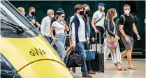  ?? JACK BOSKETT ?? Right: Face coverings, as seen at London Paddington station on July 19, are now compulsory on public transport throughout the UK unless passengers have an exemption.