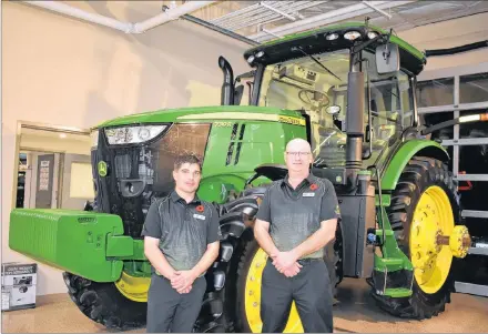  ?? DESIREE ANSTEY/ JOURNAL PIONEER ?? Long-term employees Colin Pearce, the corporate aftermarke­t manager, from left, and Jeff Wood, the Summerside store manager are proud to be at the grand opening of the Green Diamond Equipment dealership in Summerside.