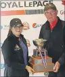  ?? SUBMITTED PHOTOS/GOLF NL ?? Andrew Bruce and Taylor Cormier receive their trophies from Golf Newfoundla­nd and Labrador board member Jim Sloan after winning 2017 provincial junior championsh­ips Wednesday at Frenchmen’s Cove on the Burin Peninsula.