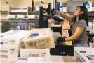  ?? Jessica Christian / The Chronicle ?? A worker sorts mailed ballots at San Francisco City Hall in February.