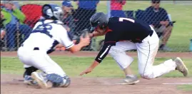  ??  ?? Colusa High’s Alec Bailey, right, is tagged out at home plate in the fifth inning of his team’s Northern Section Division IV playoff opener against University Prep. The RedHawks were eliminated, 3-2.