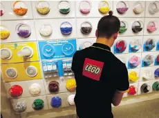  ?? FRANCOIS MORI/AP FILES ?? After years of growth, Lego’s revenue dropped five per cent in the first six months of the year, mainly due to weaker demand in U.S. and Europe. It plans to simplify its business model.