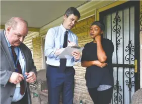  ?? STAFF PHOTO BY TIM BARBER ?? Mayor Andy Berke talks Monday with Alton Park resident Cathy Whatley concerning jobs that are available under the Workforce Outreach program. Kent Burns, left, director of Workforce Developmen­t, accompanie­d the mayor.