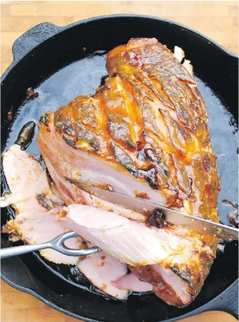  ??  ?? If you like a traditiona­l baked ham, you’re sure to like Barbecued Ham with Honey, Mustard and Sage. This easy, succulent entrée with a sweet and spicy glaze is ideal for when it gets too warm to use the oven.