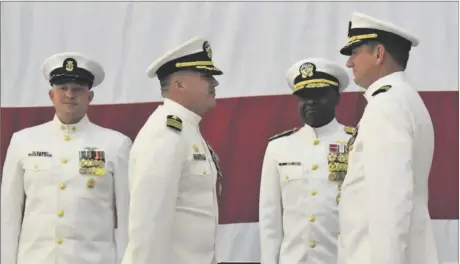  ?? PHOTO TOM BODUS ?? Retiring Navy Capt. William Perkins (second from left) turned over command of Naval Air Facility El Centro to Capt. Michael D. Lee (far right) in a ceremony held Tuesday.