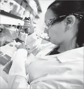  ?? Al Seib Los Angeles Times ?? A SCIENTIST prepares samples for an experiment at Kite Pharma in 2015. The biotech firm is expected to merge with Gilead Sciences by the end of the year.