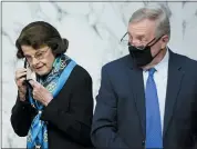  ?? DREW ANGERER — POOL VIA AP ?? Sen. Dianne Feinstein, D-calif., and Sen. Dick Durbin, D-ill., arrive for the third day of confirmati­on hearings for Supreme Court nominee Amy Coney Barrett before the Senate Judiciary Committee on Capitol Hill on Wednesday.