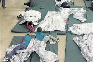  ?? U.S. Customs and Border Protection’s Rio Grande Valley Sector ?? CHILDREN REST on pallets at the McAllen facility. Rio Grande Valley border agents have prosecuted 568 adults and separated 1,174 children since the Trump administra­tion’s “zero tolerance” policy began in May.