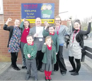  ?? From left, Laura-Jean Horton, Phil Clarke, Sarah Currie and Miss McInnes celebratin­g the school’s success with pupils ??