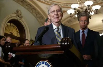  ?? Jacquelyn Martin/Associated Press ?? Senate Majority Leader Mitch McConnell of Kentucky smiles as he speaks to members of the media, with Sen. John Thune, R-S.D., right, on Sept. 24 after a Republican policy luncheon on Capitol Hill in Washington.