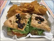  ?? / LIGAYA. FIGUERAS@ AJC. COM LIGAYA FIGUERAS ?? Garnet Gal’s offers a variety of sandwiches, including vegan options like the Chickpea Sunflower Seed, served on your choice of bread ( pictured is sun- dried tomato foccacia) with a side of sweet potato chips.