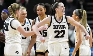  ?? PHOTOS BY MARY ALTAFFER/AP ?? Iowa guard Caitlin Clark, the biggest star in college basketball, reacts during the fourth quarter of Monday’s game against LSU in Albany, N.Y. Clark had 41 points and 12 assists in the Hawkeyes’ 94-87 win.