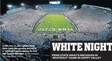  ?? THE ASSOCIATED PRESS] [CHRIS KNIGHT/ ?? In this Oct. 21, 2017, photo, Penn State takes the opening kick off in a “whiteout” game, during the first half against Michigan.