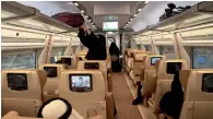  ?? AFP ?? Saudi passengers are seen inside a train compartmen­t at Makkah’s train station. —