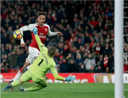  ?? — AFP ?? Arsenal’s Pierre-Emerick Aubameyang scores his debut goal during the Premier League match against Everton at the Emirates Stadium.