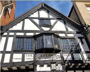  ?? ?? LEFT: The Eclipse Inn, Winchester. BELOW LEFT: Manager Elliot Fearne beneath a portrait of Lady Alice Lisle.