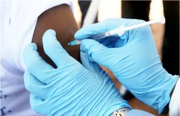  ??  ?? File photo shows a WHO worker administer­ing a vaccinatio­n during the launch of a campaign aimed at beating an outbreak of Ebola in the port city of Mbandaka, Democratic Republic of Congo. — Reuters photo