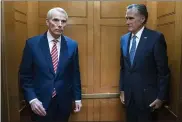  ?? JOSE LUIS MAGANA — THE ASSOCIATED PRESS ?? Sen. Rob Portman, R-Ohio, left, accompanie­d by Sen. Mitt Romney, R-Utah, leave in the elevator after a closed door talks about infrastruc­ture on Capitol Hill in Washington on July 15.