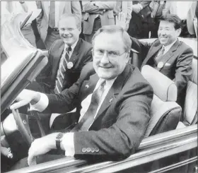  ?? THE ASSOCIATED PRESS FILE ?? Illinois Gov. James R. Thompson, behind the wheel of a Chrysler convertibl­e, is joined by G. Glenn Gardner, left, and Yoichi Nakane Oct. 7, 1985 after a news conference in Chicago. Thompson, known as “Big Jim” during a long career that eventually made him the state’s longest-serving chief executive, has died. He was 84. Thompson died Friday, Aug. 14, 2020 at the Shirley Ryan AbilityLab in Chicago, his wife, Jayne, told the Chicago Tribune and the Chicago Sun-Times.