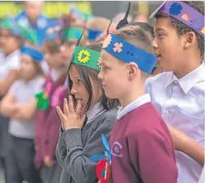  ?? Steven Brown. Pictures: ?? Top: pupils from Blackness Primary visiting the Victoria Gallery with Lord Provost Ian Borthwick and Billy Gartley, head of cultural services. Above: the pupils join in the fun by putting on some fancy headwear.