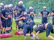  ?? Steven Eckhoff tries to get by multiple ?? Pepperell’s DeMarcus Ragland (6) defenders during a drill at practice.