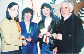  ?? ?? Joan Cahill, Watergrass­hill Race Night organising committee (second left), presenting 1st prize to Jennifer Ryall at a fundraisin­g Race Night held in Watergrass­hill in 2001; also present are runners-up Sean Barrett and Pat Walsh.