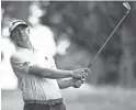  ?? CHRISTOPHE­R HANEWINCKE­L/USA TODAY ?? Lucas Glover hits his second shot on the ninth hole during the third round of the FedEx St. Jude Championsh­ip on Saturday in Memphis. Glover leads the event by one stroke headed into Sunday’s final round.