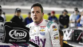  ?? JOHN RAOUX / AP ?? Alex Bowman climbs out of his car after qualifying for the NASCAR Daytona 500 auto race Wednesday. Bowman, who missed five races late last season because of a concussion, is on the Daytona 500 front row for the sixth straight time