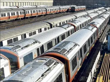  ?? JIM MICHAUD / boston Herald ?? orange line trains sit in the yard at an mbta station on sunday in malden.