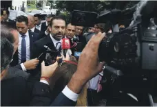  ?? AFP ?? Lebanese PM Saad Hariri speaks to the media in front of the Special Tribunal for Lebanon in The Hague. The tribunal is investigat­ing the assassinat­ion of Mr Hariri’s father in 2005