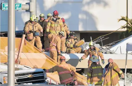  ?? Picture / AP ?? Fire crews used high-tech listening devices, trained sniffing dogs and search cameras to try to find survivors.