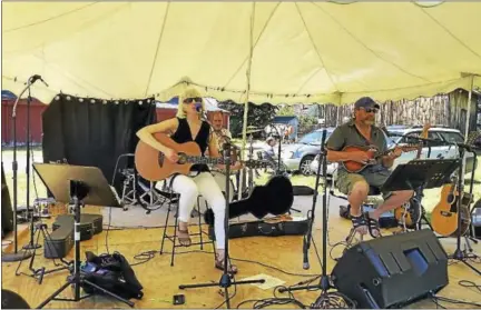  ?? PHOTO / N.F. AMBERY ?? The folk duo Martha and Andy sung such cover songs such as Peter, Paul and Mary’s “Leaving on a Jet Plane” and Johnny Cash and June Carter Cash’s duet “Jackson” (among 12 local musical acts total) at the first-ever Still River Music Festival at the...