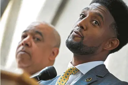  ?? KARL MERTON FERRON/BALTIMORE SUN ?? Police Commission­er Michael Harrison, left, shares the lectern with Mayor Brandon Scott on Wednesday.