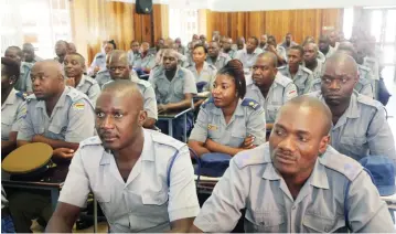  ??  ?? Police assistant Inspectors follow proceeding­s at a Zimbabwe Republic Police re-branding refresher course in Harare yesterday. Picture: Aaron Nyamayaro)