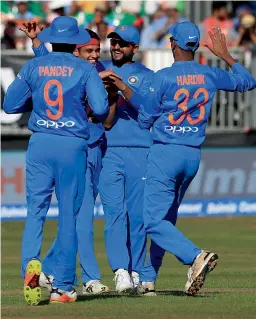  ??  ?? — AP Indian players celebrate the fall of an Ireland wicket in the second T20 in Dublin on Friday. India won the match by 143 runs.