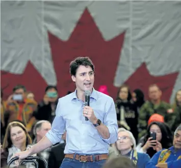  ?? SEAN KILPATRICK/THE CANADIAN PRESS ?? Prime Minister Justin Trudeau takes part in a town hall meeting, in Yellowknif­e, N.W.T, on Friday.