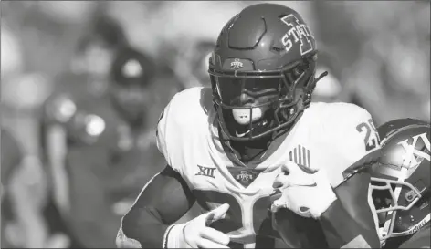  ?? ASSOCIATED PRESS ?? IOWA STATE RUNNING BACK BREECE HALL (28) gets past Kansas cornerback Kyle Mayberry (8) during the first half of a game in Lawrence, Kan., Saturday.