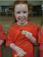  ??  ?? Competitor­s in dance movement being presented with medal by Anne Taaffee, Sligo Community Games.