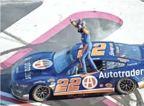  ?? HAKIM WRIGHT SR./AP ?? Joey Logano celebrates after winning the NASCAR Cup Series race at Atlanta Motor Speedway on Sunday.