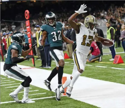 ?? BILL FEIG — THE ASSOCIATED PRESS ?? New Orleans Saints wide receiver Michael Thomas crosses into the end zone in front of Philadelph­ia Eagles cornerback Rasul Douglas (32) and free safety Corey Graham on a touchdown reception in the second half of an NFL football game in New Orleans, Sunday.
