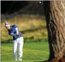  ?? DAVID CANNON/GETTY IMAGES  ?? Feisty Norwegian Suzann Pettersen plays her second shot on the 18th hole during the singles matches at the Solheim Cup on Sunday.