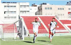  ?? — Reuters photo ?? Iraq’s Mustafa Nathem celebrates scoring a goal.