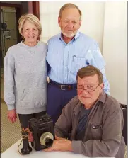  ?? Photo by David Deaton/LeFlore County Museum ?? Sharon, left, and local attorney Ted Knight, back, present an old-style telephone to Robert Lowrey to be placed for public view at the LeFlore County Museum.