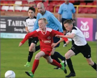  ??  ?? Action from Sligo/Leitrim v Derby County in 2018. Below: John Barton, Academy Operations Manager with Dercy and Packie Lynch, Tournament Director Sligo Super Cup. Pic: Donal Hackett,